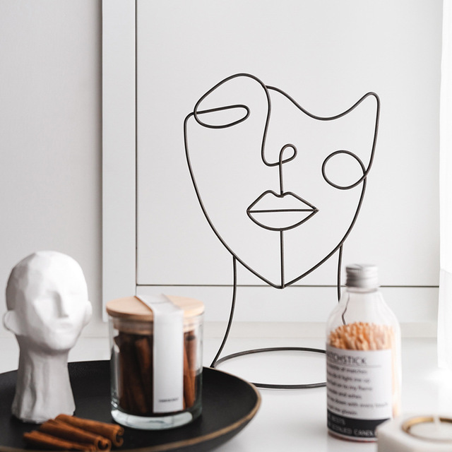 Abstract Metal Face Figure Ornament